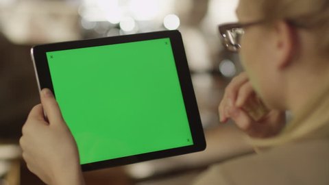 Girl Using Tablet PC with Green Screen. Shot on RED Digital Cinema Camera in 4K (ultra-high definition (UHD)), so you can easily crop, rotate and zoom.
Easy for tracking and keying.
ProRes HQ codec.

