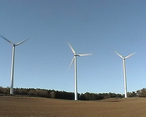 Wind farm in a field.