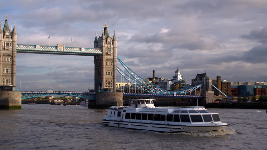LONDON, UK - OCTOBER 11, 2011: Panning view of ship and Tower Bridge in London,