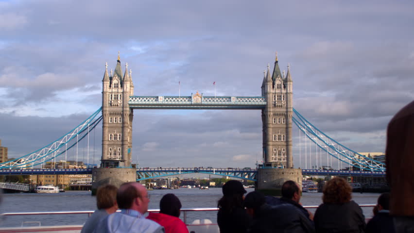 LONDON, UK - OCTOBER 11, 2011: tourists on ship take pictures of Tower Bridge