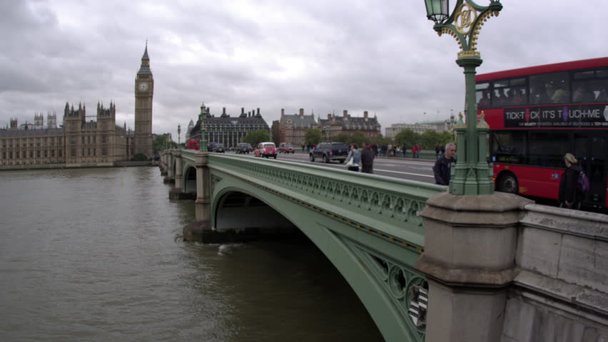 LONDON, UK - OCTOBER 11, 2011: Upward panning view, people cross Westminster