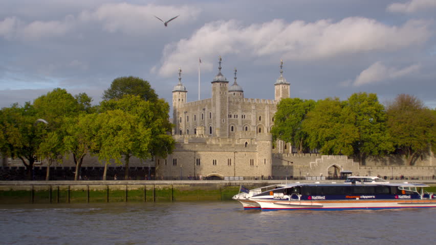 LONDON, UK - OCTOBER 11, 2011: Ship passes in front of tower of London in