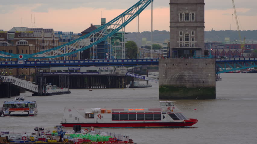 LONDON, UK - OCTOBER 10, 2011: City cruise boat by Tower Bridge