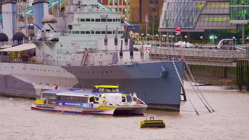 LONDON, UK - OCTOBER 10, 2011: Boat passing a ship on river Thames