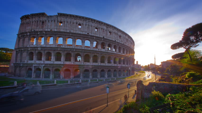 Time-lapse of the Colosseum and street traffic at sunset