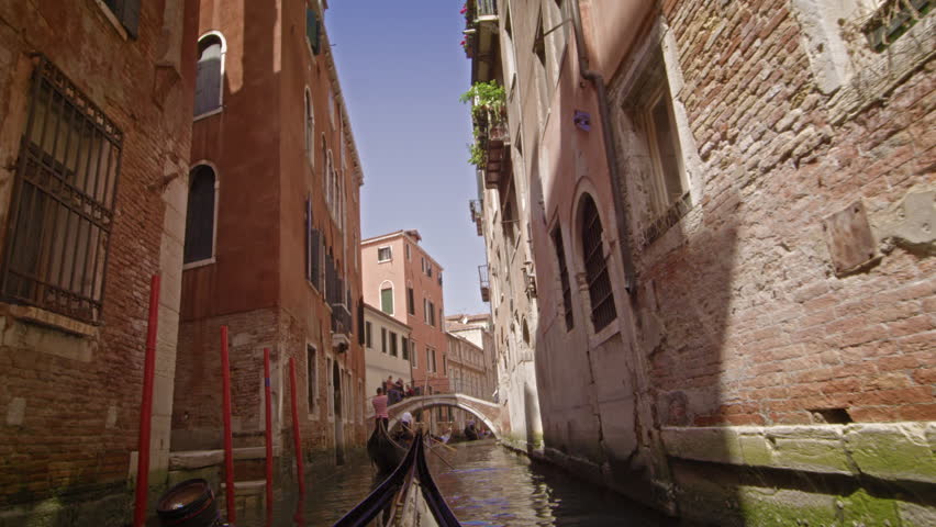 View from a gondola as it glides through a back alley canal