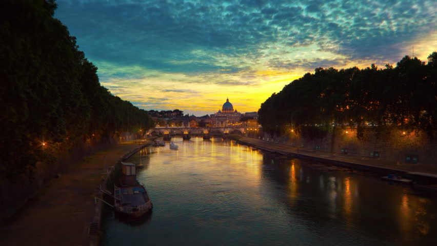 Vibrant sunset time-lapse of the Vatican City, from across the Tevere River