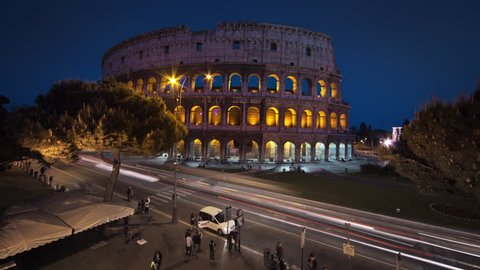 Nighttime time-lapse of the Colosseum and street traffic