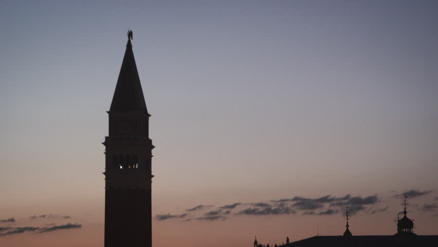 Slow panning down shot of Piazza San Marco and the Doge's palace ending still on