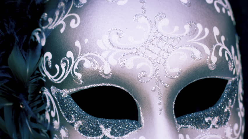 Close up tilting down shot of an elegant carnival mask