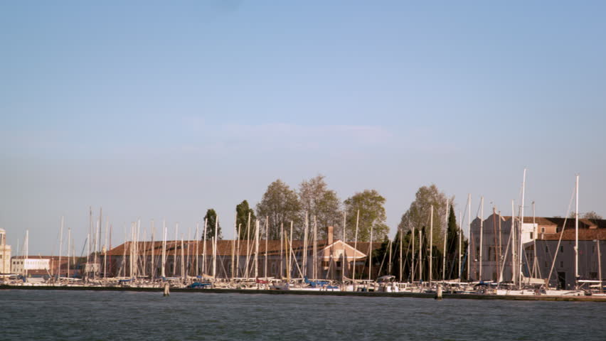Panning shot of the marina and cathedral at the Island of San Giorgio