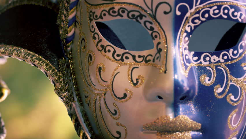 Close up shot of an artistic carnival mask blowing in the wind