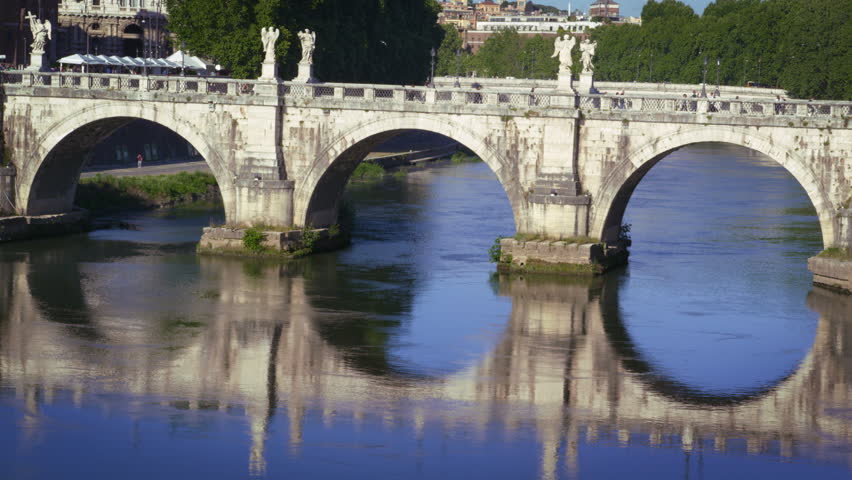 Ponte Sant'Angelo is reflected in the Tiber River