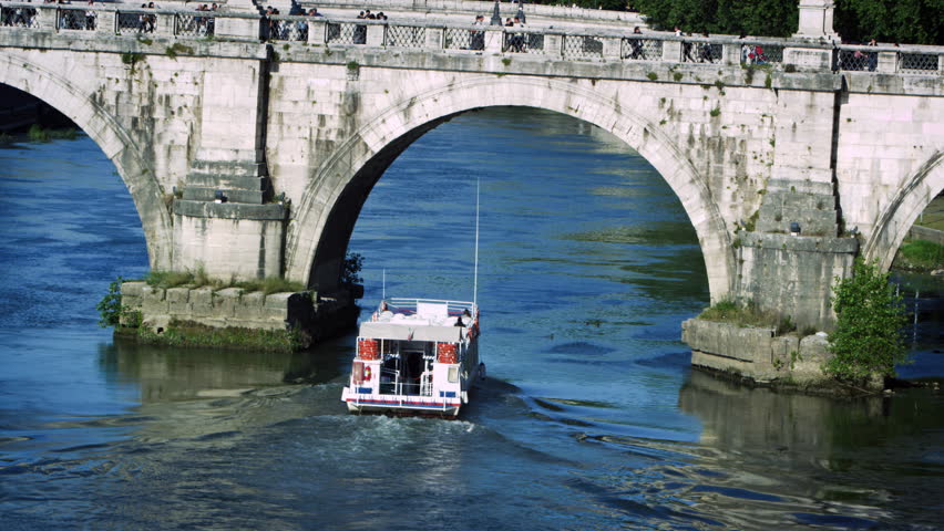 Barge passes under arch of Ponte Sant'Angelo