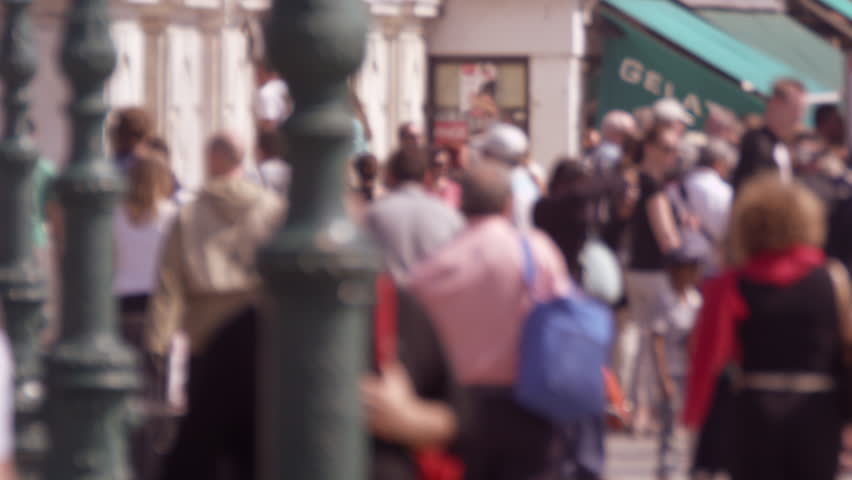 Slow motion shot of crowed walkway in front of the venetian train station