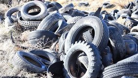Discarded automotive tires in the desert sun. Not being recycles just wasting away and making the landscape ugly.
