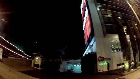 WEST HOLLYWOOD, CA: February 27, 2014- Wide shot of driving at night past The Comedy Store night club Sunset Boulevard circa 2014 in West Hollywood. This clip features driving on the Sunset Strip.