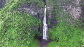 2.7K Ultra HD Smooth Aerial View Forward Tracking Shot of Remote Picturesque Tropical Waterfall in Kauai Hawaii HD Video