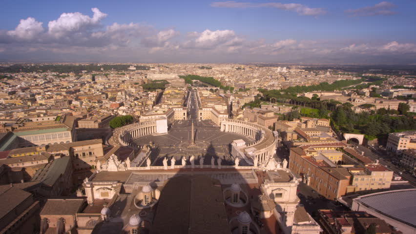 Aerial footage of St Peter's plaza and the rooftops of Rome