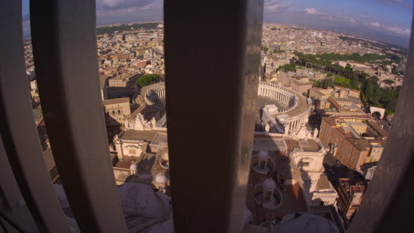 Tracking footage of Rome skyline from behind guardrail