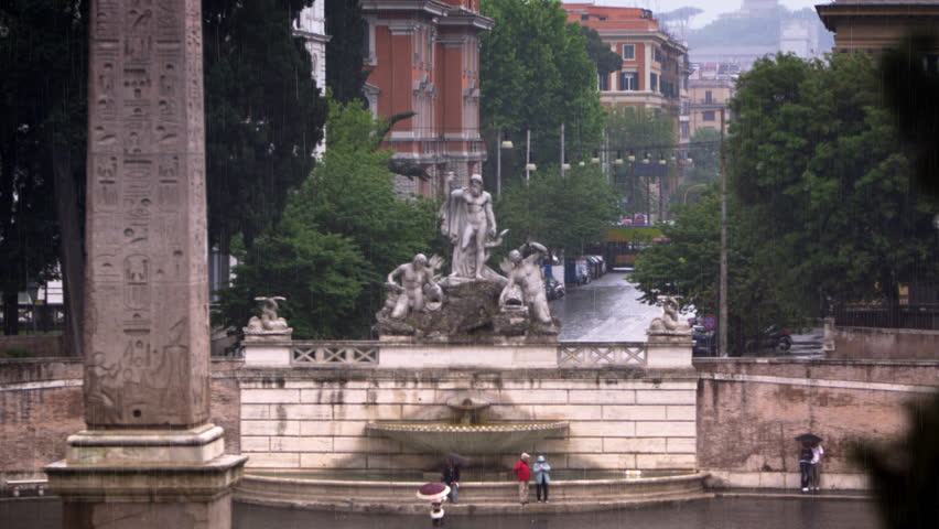 Fontana del Nottuno and nearby obelisk on a rainy day