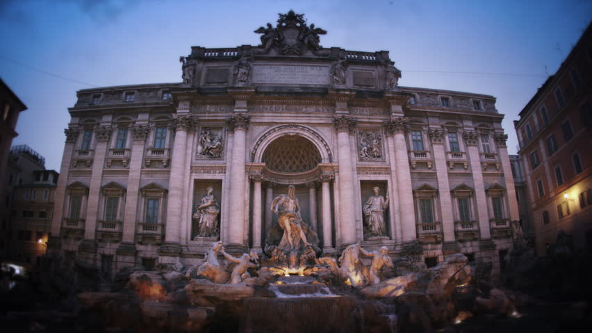 Slow motion footage of the Trevi Fountain at dusk