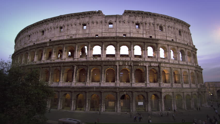 Still shot of Colosseum and Constantine's Arch at dusk
