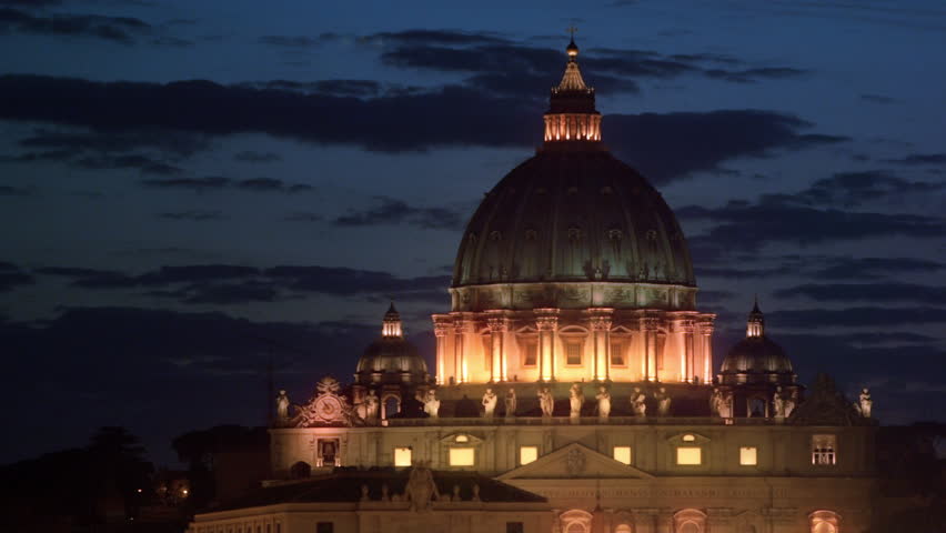 Close up shot of dome of illuminated St Peter's Basilica at night