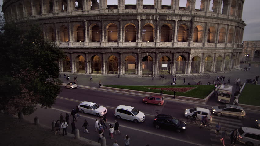 Tilt up to Colosseum and Constantine's Arch at dusk
