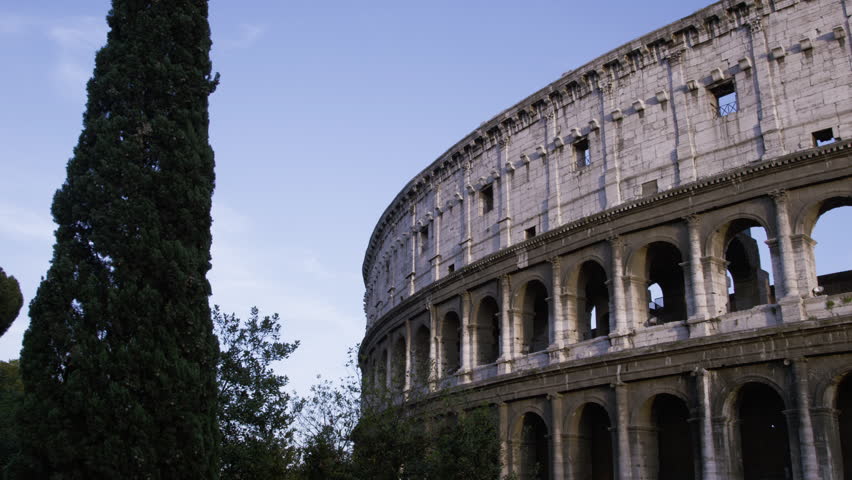 Left-to-right pan of tall side of Colosseum