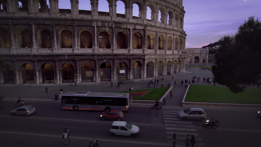 Tilt up to Colosseum and Constantine's Arch