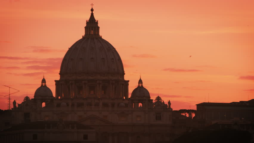 Close up footage of dome of St Peters Basilica as the sun sets