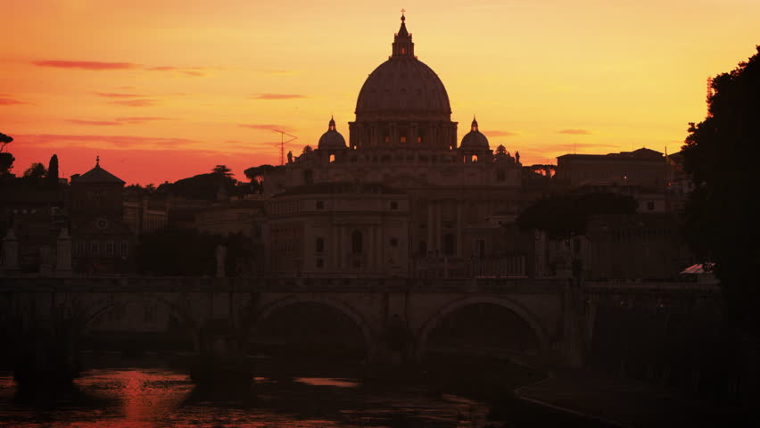 North side of Ponte Sant Angelo and St Peters Basilica at sunset