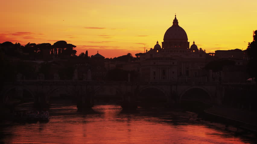 St Peters and Ponte SantAngelo against a pink sunset