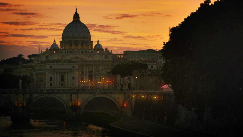 North side of the Ponte Sant Angelo and St Peters Basilica at dusk