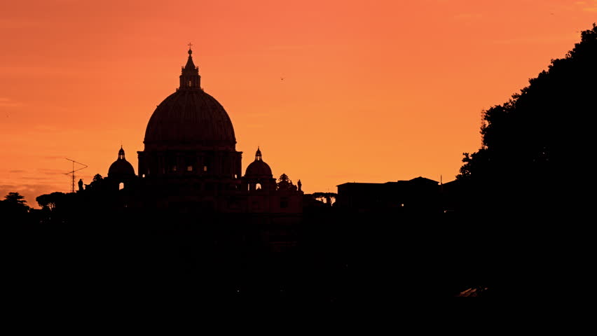 St Peters Basilica against a purple sunset