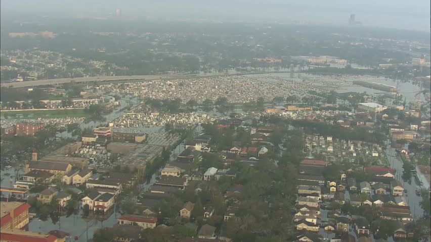 Hurricane Katrina Flood. The severe destruction left behind by Hurricane Katrina. Headstones stick out of flooded cemetery.