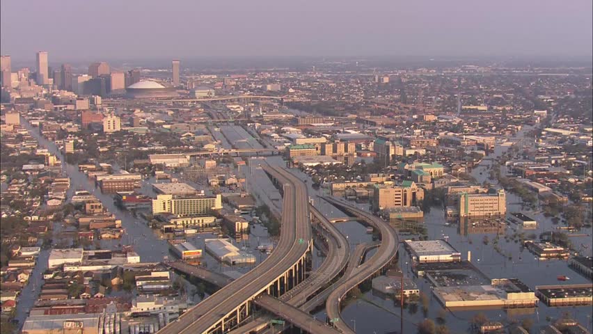 Flood City Street Helicopter. Submerged freeway and New Orleans buildings.