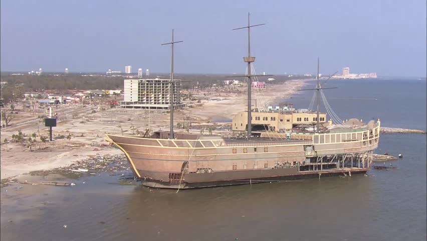 Hurricane Katrina Shoreline Dock. A blown out ship docked on the beaches of New Orleans, Louisiana after the destruction of Hurricane Katrina. Pieces of the ship literally float away in the water.