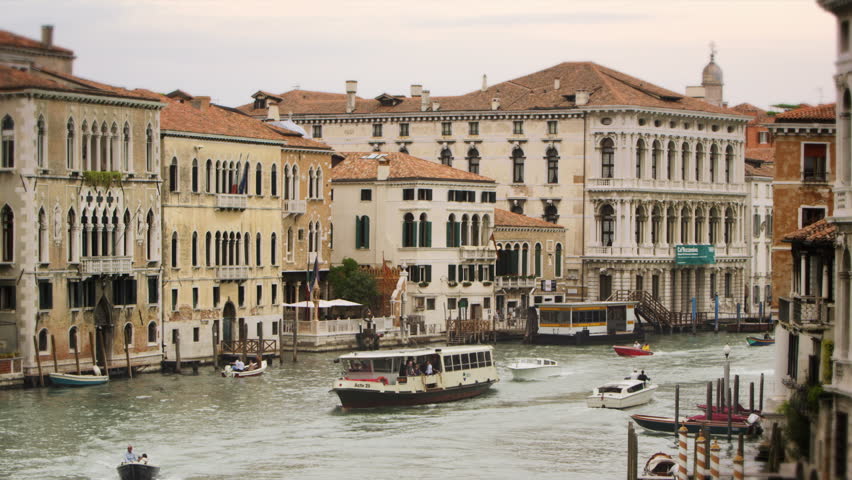 VENICE, ITALY - MAY 2, 2012: Boats passing by on a Venetian canal