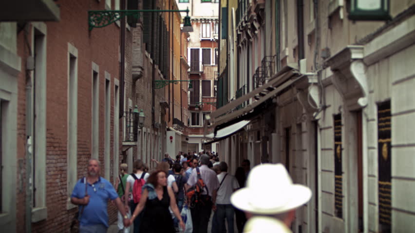 VENICE, ITALY - MAY 2, 2012: Slow motion shot of people moving down narrow