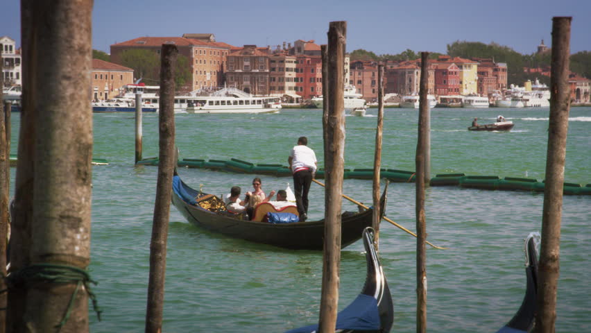VENICE, ITALY - MAY 2, 2012: Slow motion shot of gondola leaving docking area