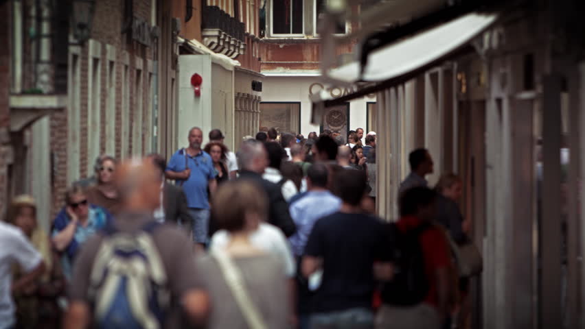 VENICE, ITALY - MAY 2, 2012: Slow motion shot as people stroll down a Venetian