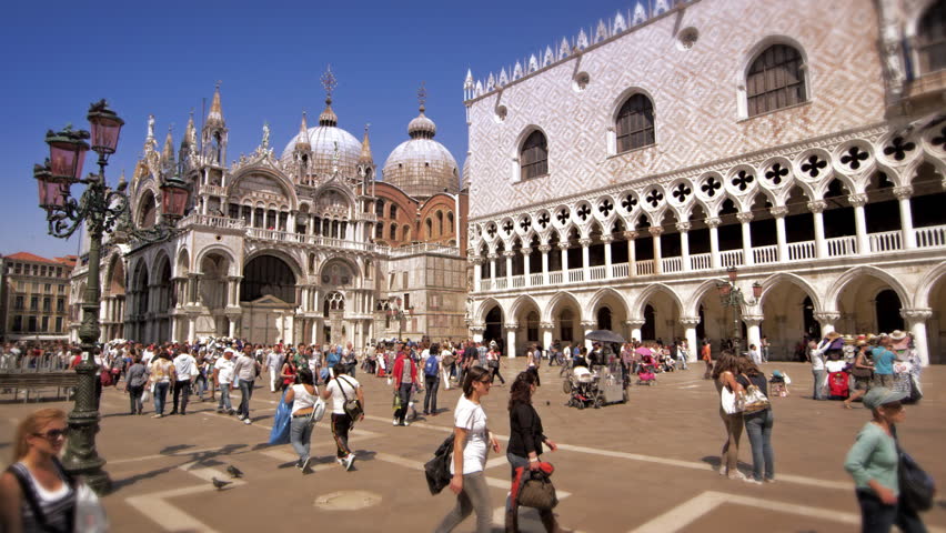VENICE, ITALY - MAY 2, 2012: Slow motion shot of people walking through Piazza
