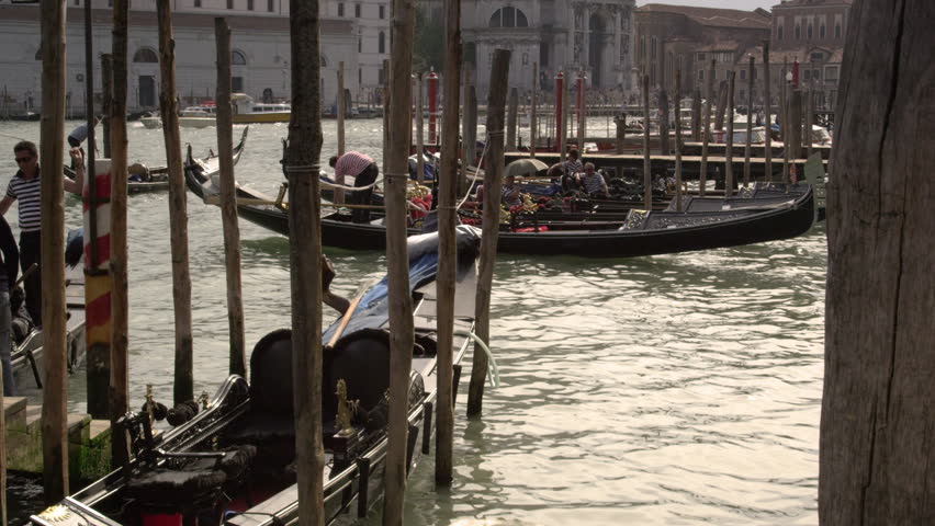 VENICE, ITALY - MAY 2, 2012: Time-lapse, tilt shot of gondola dock