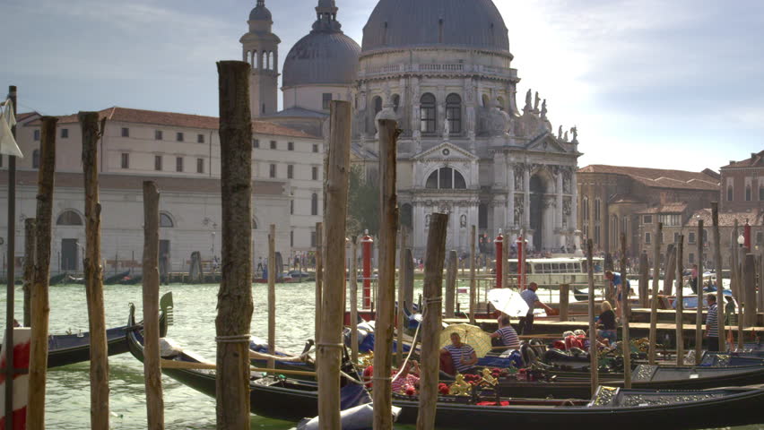 VENICE, ITALY - MAY 2, 2012: Busy gondolier docks near Santa Maria della Salute