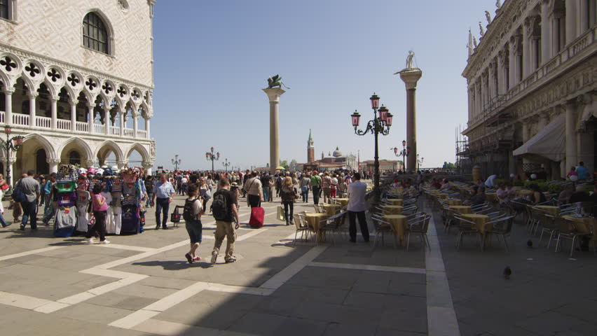 VENICE, ITALY - MAY 2, 2012: Slow motion shot of people entering and exiting