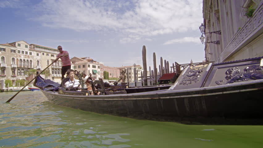 VENICE, ITALY - MAY 2, 2012: A couple take a gondola ride on the Grand Canal.