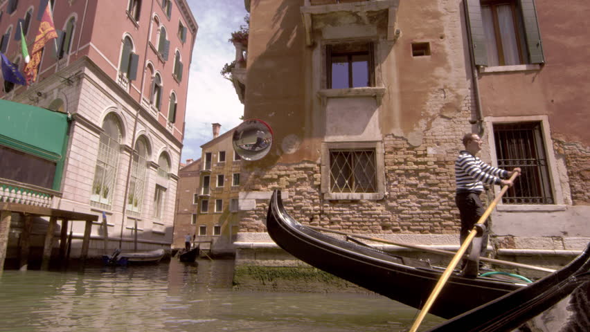 VENICE, ITALY - MAY 2, 2012: Gondola stopping in slow motion