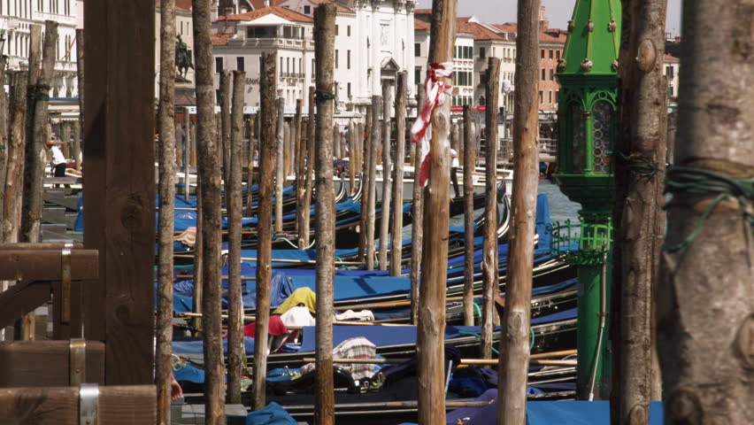VENICE, ITALY - MAY 2, 2012: Slow motion shot of docked gondolas bobbing